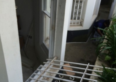 Removing Metal Security Bars from a Window for a Removal